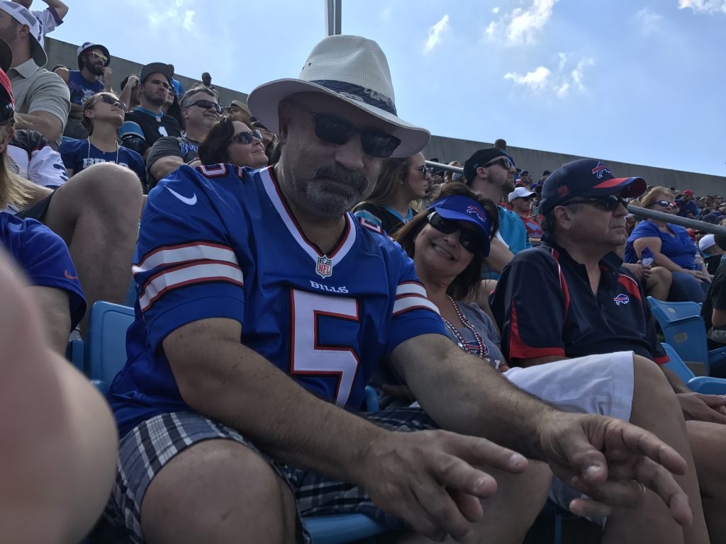 Mick Vetrano wearing a Buffalo Bills jersey and sun hat